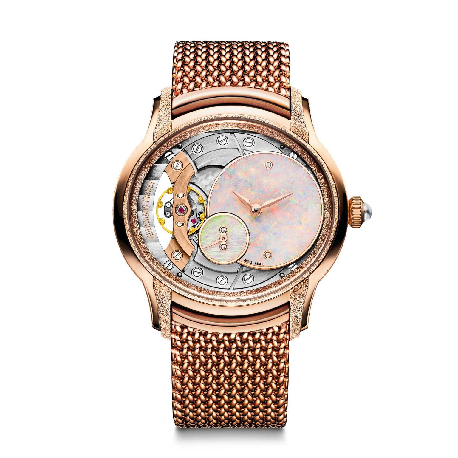 Audemars Piguet Millenary pink gold ladies' watch features an opal dial and exposed workings of the hand-wound calibre. 
