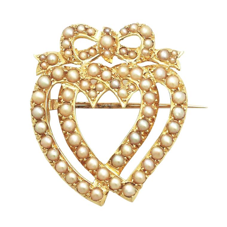 ACS Antiques & Collectibles pearl and yellow gold heart entwined brooch