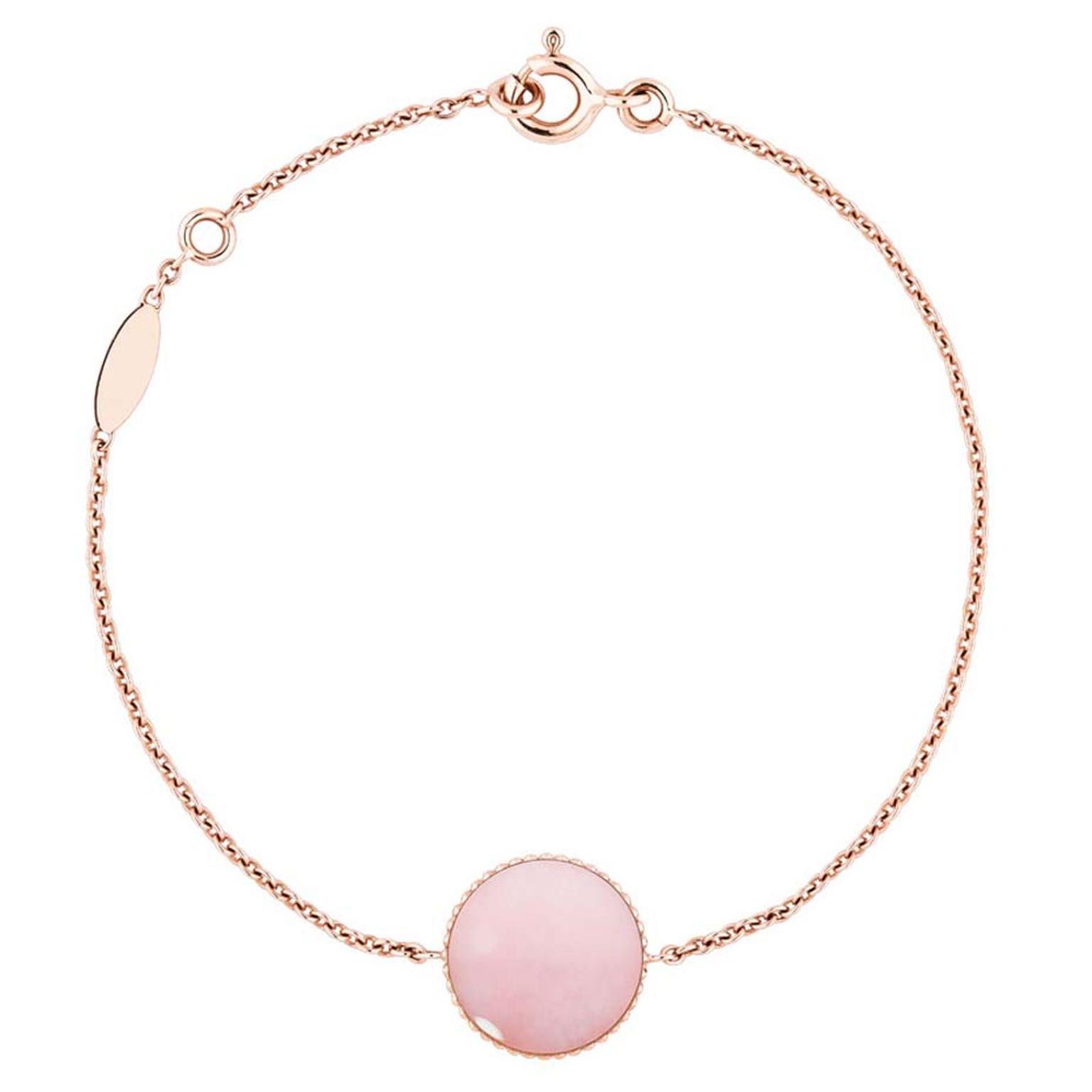 The rosy hue of the pink opal can be seen clearly on the reverse of the Dior Rose des Vents medallion.