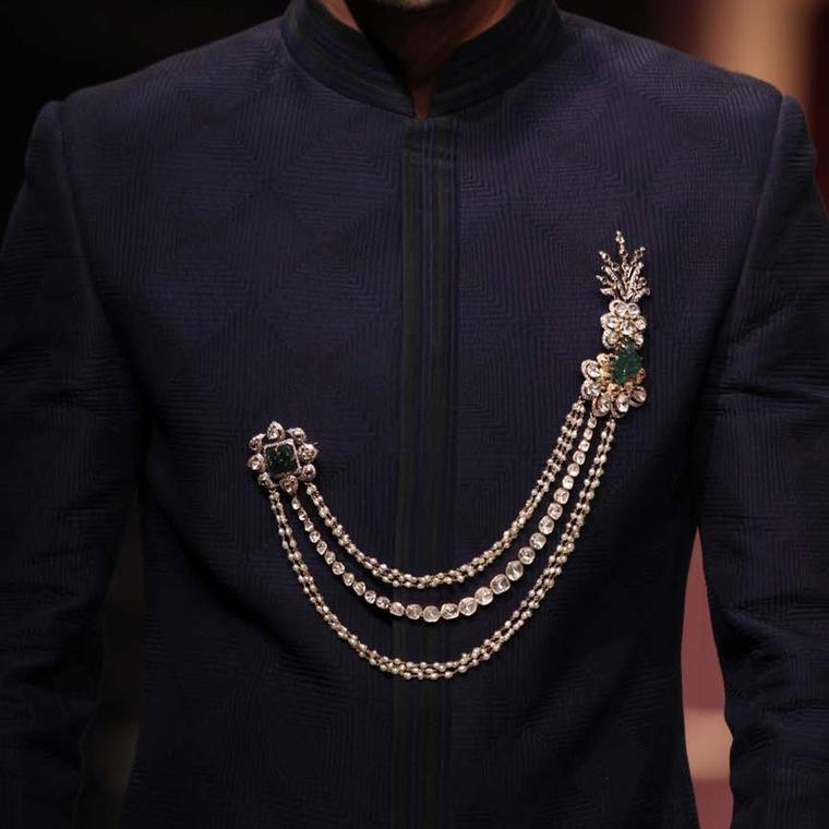 A model at the IIJW 2013 wearing a double pin brooch from the Amer collection by Birdhichand Ghanshyamdas.