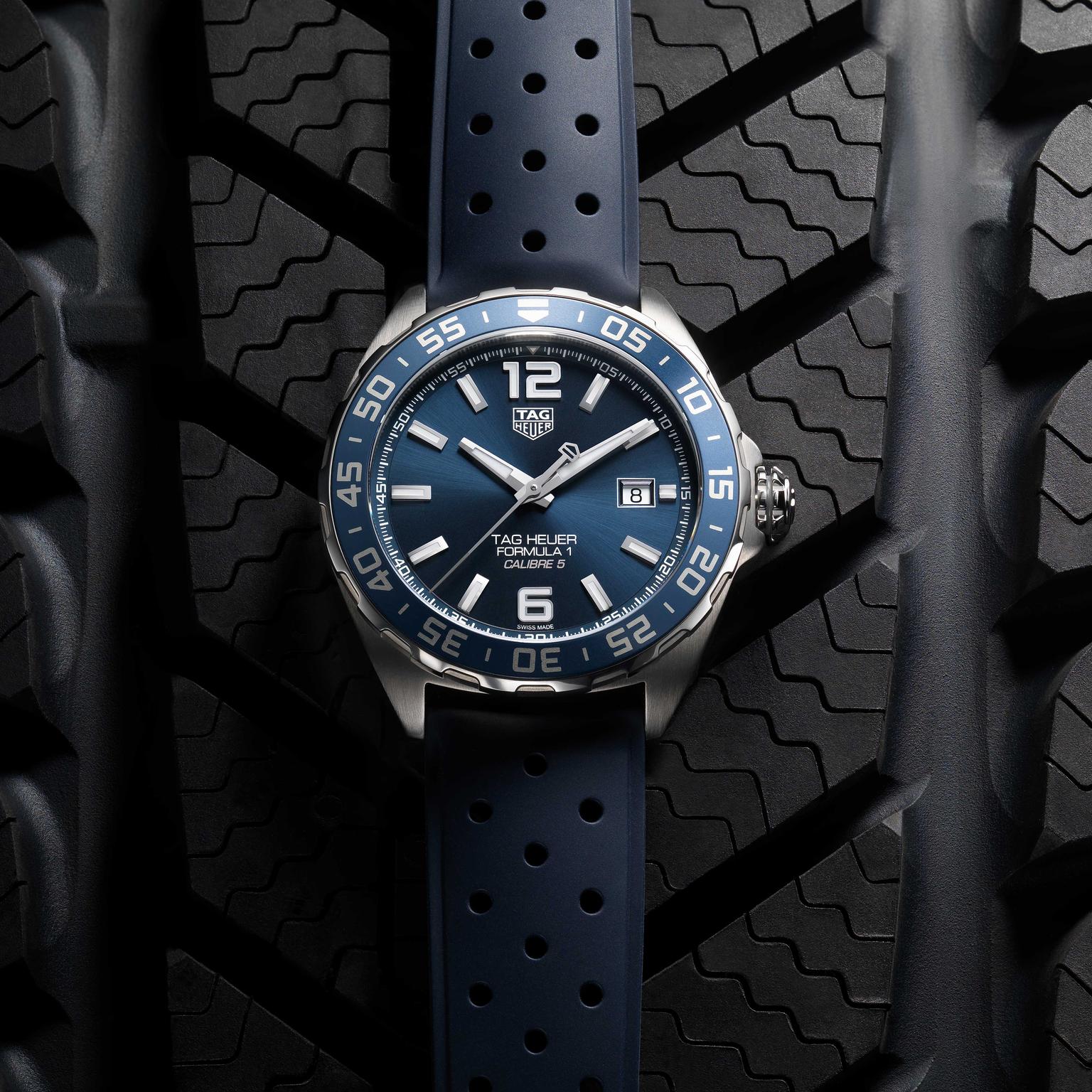 TAG Heuer Formula 1 Bucherer Blue Edition watch on rubber strap on tyre