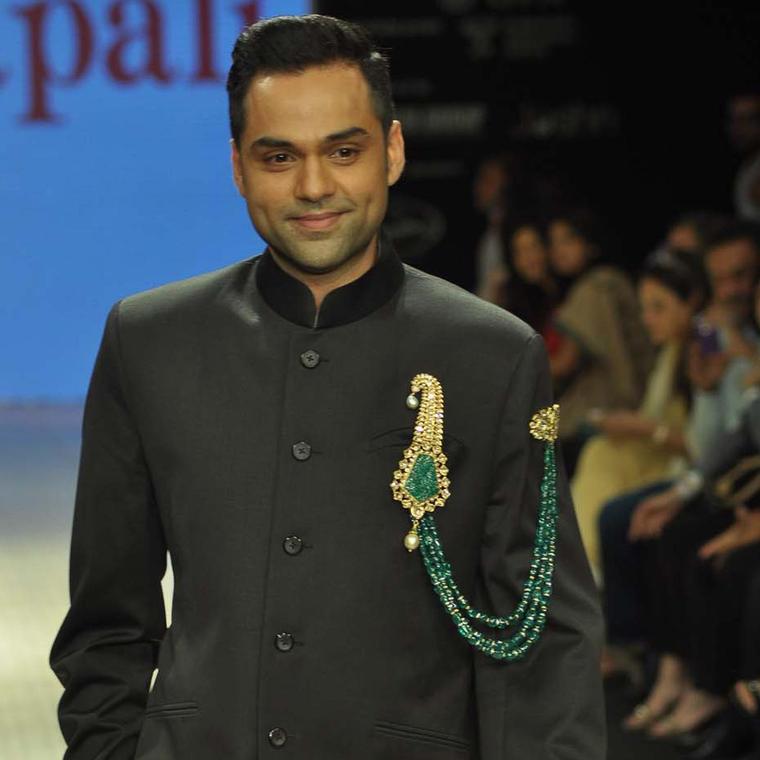 Actor Abhay Deol wearing an Amrapali emerald and kundan polki double pin brooch at Indian International Jewellery Week 2012.