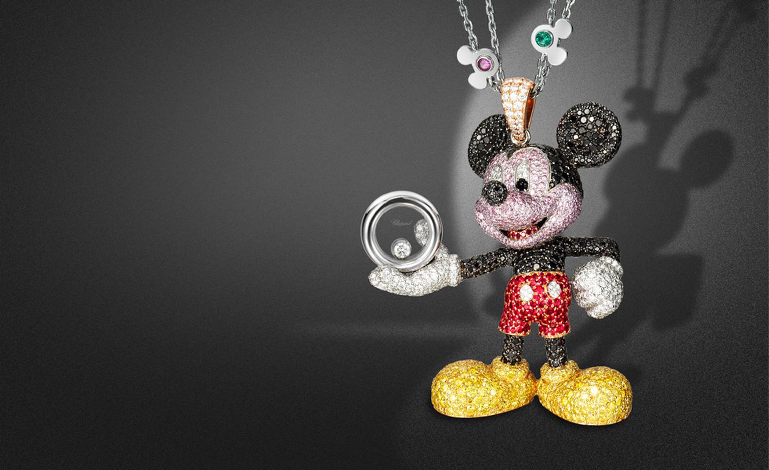 Happy Mickey pendant. In white, rose and yellow gold set with black, white, yellow and pink diamonds, rubies, onyx cabochons eyes, with one mobile diamond; on a white gold chain set with blue and pink sapphires, emeralds, rubies and amethysts. POA