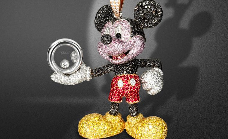 Close up of the Happy Mickey pendant sparkling with black, white and yellow diamonds - and a smart pair or ruby shorts.