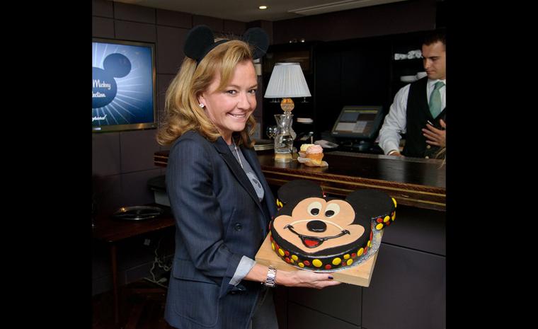 Caroline Scheufele, co-President of Chopard, with the giant Mickey Mouse brownie cake