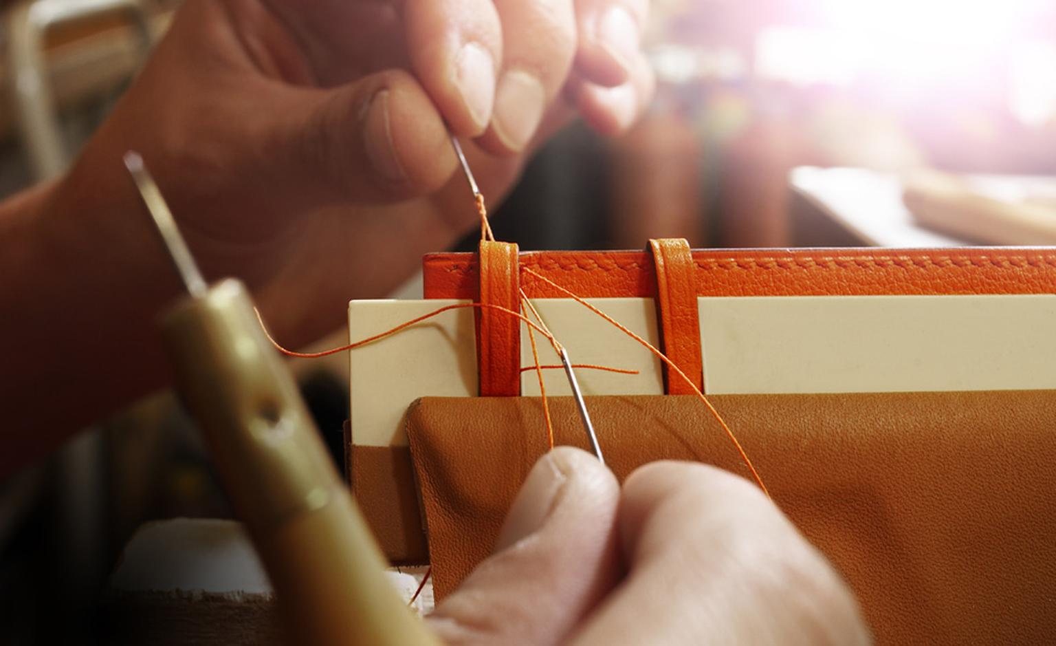 Once the leather has been cut and layered with the inner material and lining, it is sent to another workshop for stitching.