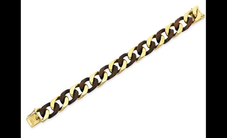 Van Cleef & Arpels wood and yellow chain bracelet was very much of its time. 1971. Estimate: $3,000-5,000 as part of a set of three pieces.