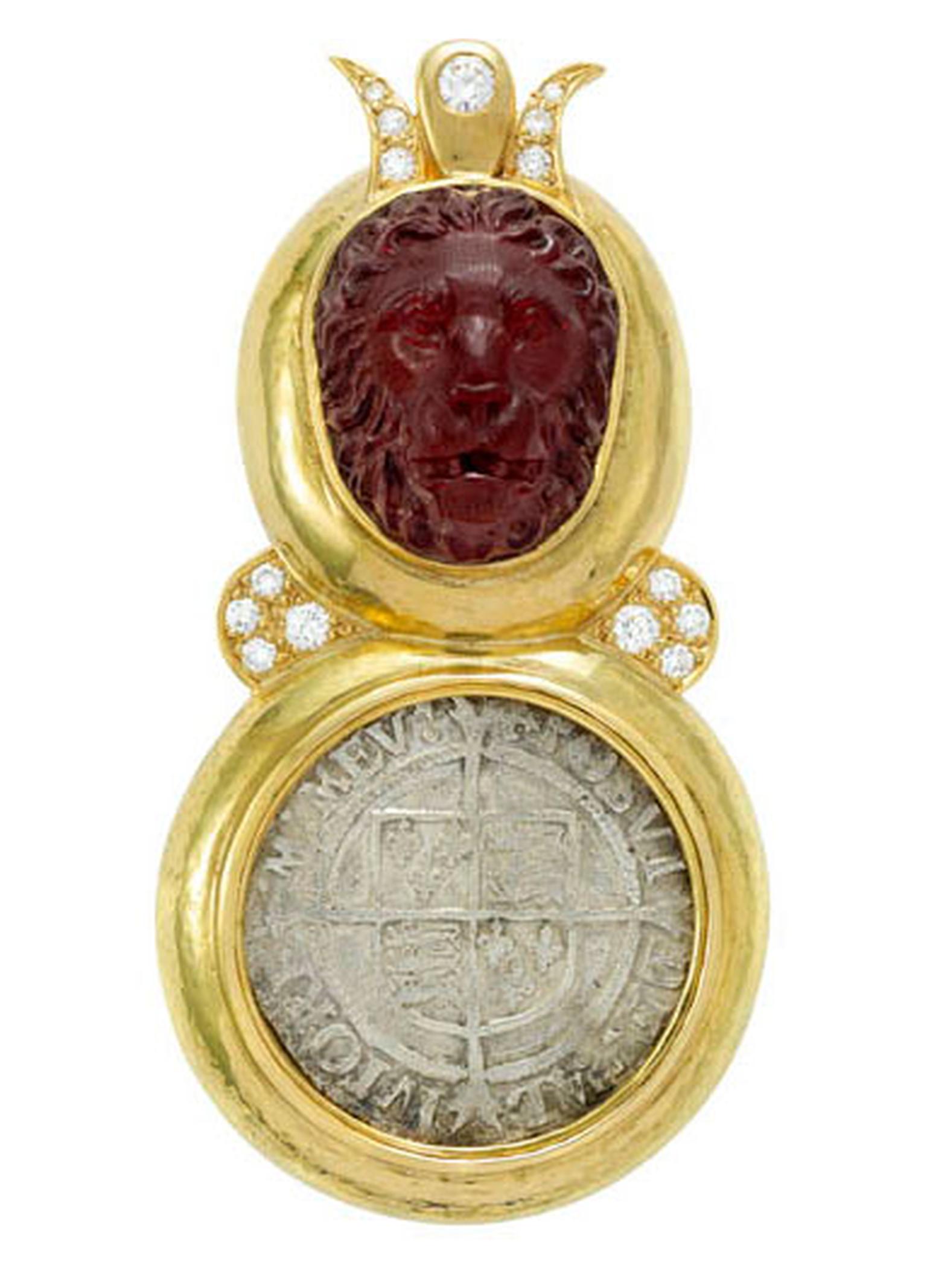 ELIZABETH GAGE, Arcadia Pin, this majestic Arcadia pin features a carved garnet lion head with a diamond crown set above an antique silver four pence coin, dating from the reign of Elizabeth I (1558-1603). The pin is decorated with diamonds. £11,400