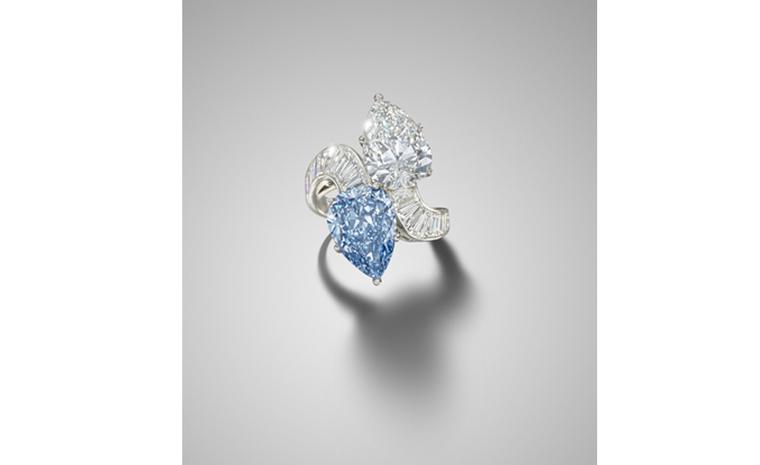 Lot 200. A diamond and blue diamond crossover ring,  by Bulgari. Estimate £600,000 - 800,000. SOLD FOR £1,889,250.