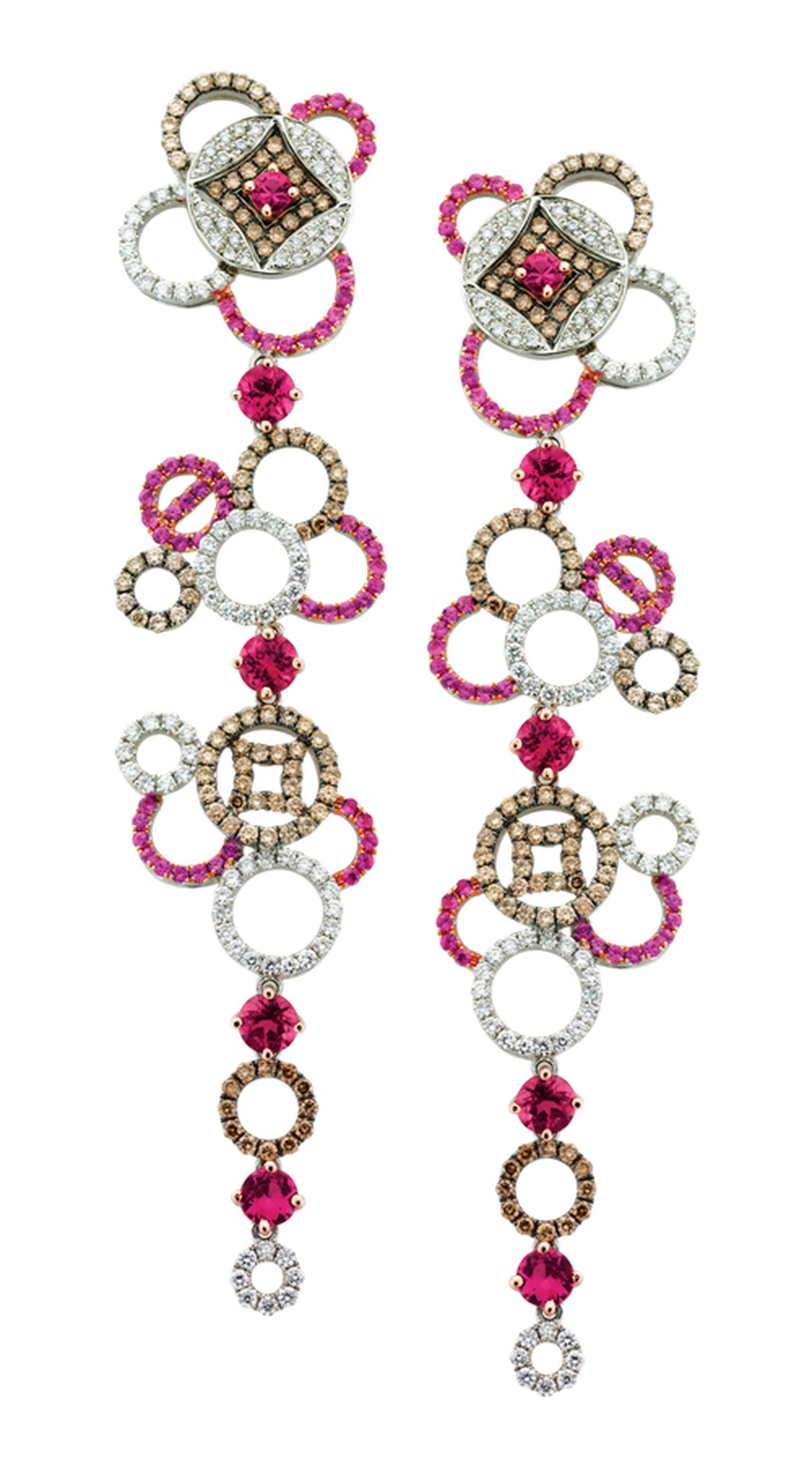 SHO Fine Jewellery Coin Drop SHO Fine Jewellery Coin Drop Earrings in 18ct White Gold with Pink Sapphires Tourmaline and White and Cognac Diamonds. £9840 in 18ct White Gold with Pink Sapphires Tourmaline and White and Cognac Diamonds. POA