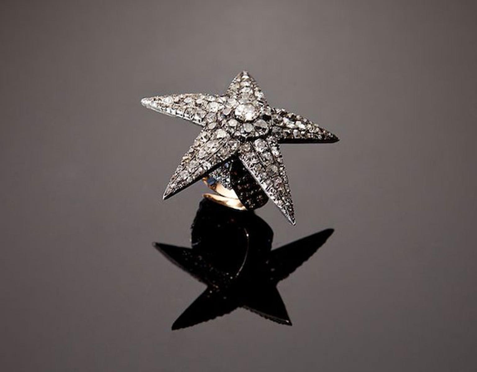 The Star as a ring. The diamond-set star screws off and the ring can be worn on its own while the star sits in the hair or dangles from a chain as a pendant.