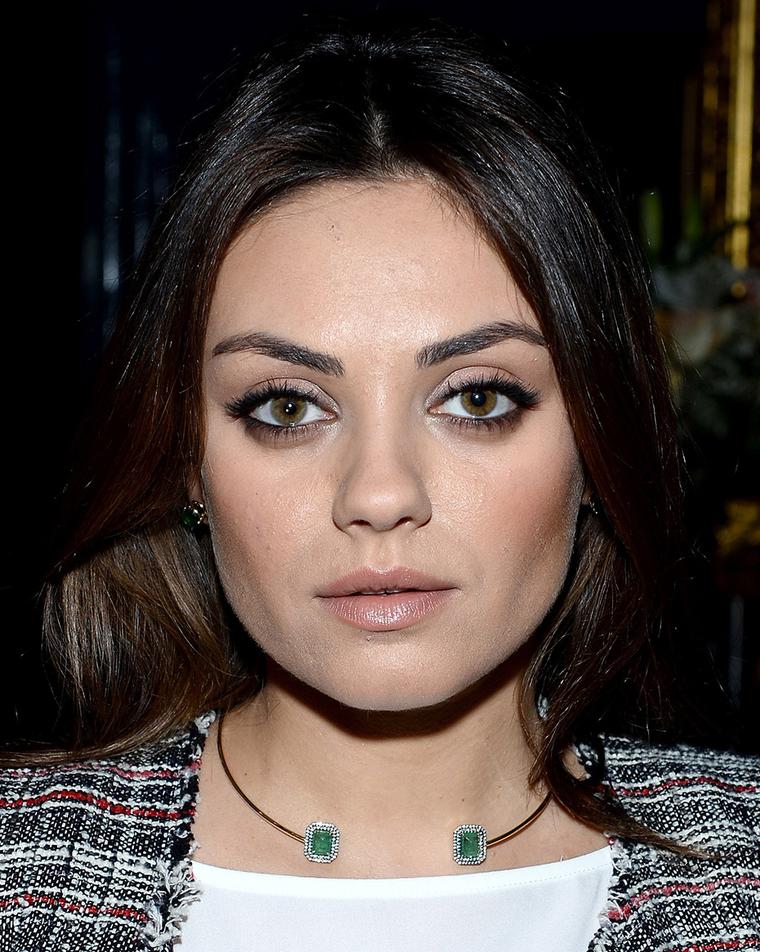 Mila Kunis wearing the Jemma Wynne emerald collar in yellow gold, created in collaboration with Gemfields