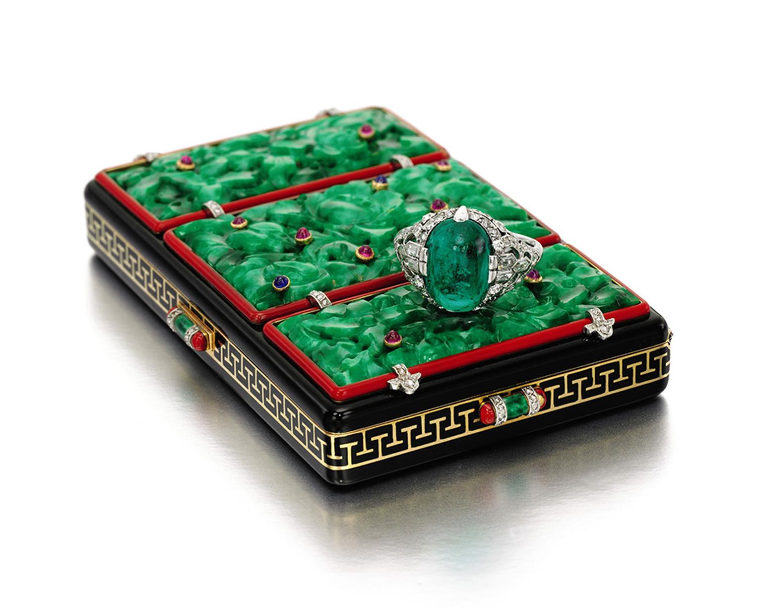 Lot 285, a Lacloche Frères 1920s gem set, enamel and diamond vanity case, set with three carved jadeite plaques inset with cabochon sapphires and rubies(estimate: £8,000-12,000; sold for £68,500), and lot 287, an emerald and diamond ring by Van Cleef & Ar