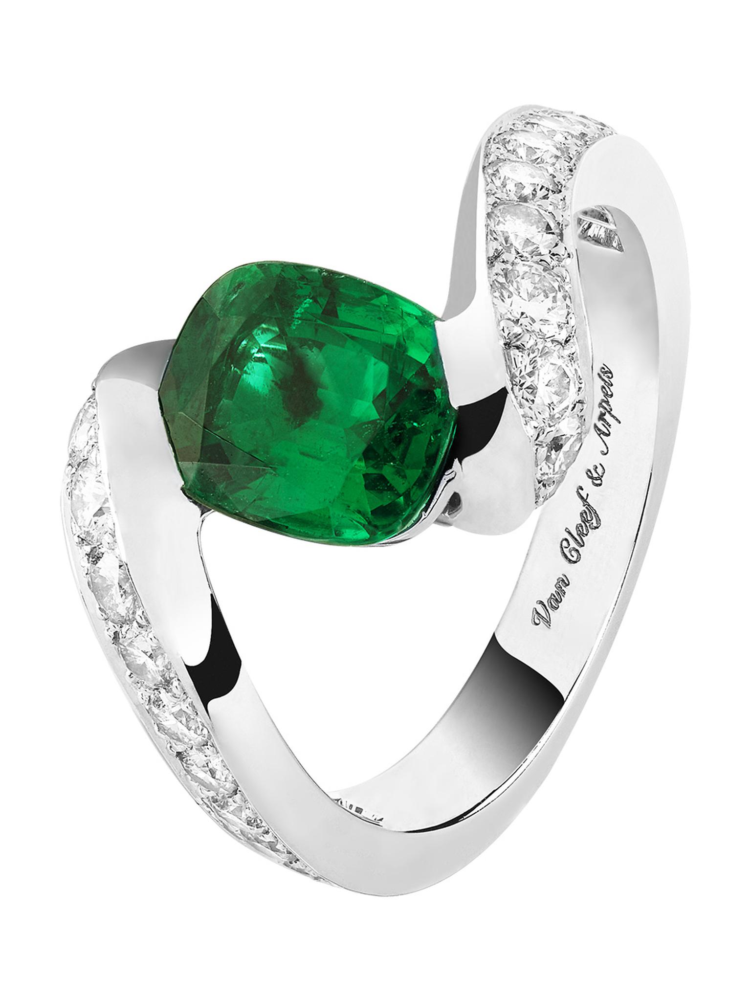 Van Cleef & Arpels Hirondelle Solitaire in platinum, set with round diamonds and a 1.79ct cushion-cut emerald.