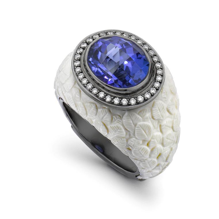 This Theo Fennell ring is skilfully carved from the tusks of a long-extinct Mammoth. The 6.52ct tanzanite, set in white gold, is framed by 0.22ct of diamonds.