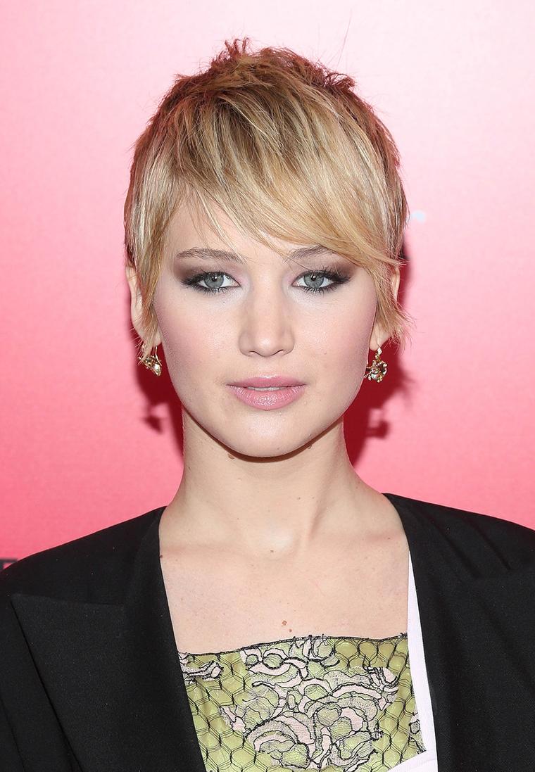 Jennifer Lawrence reveals Dior jewels beneath her newly cropped hair at Hunger Games Catching Fire premiere