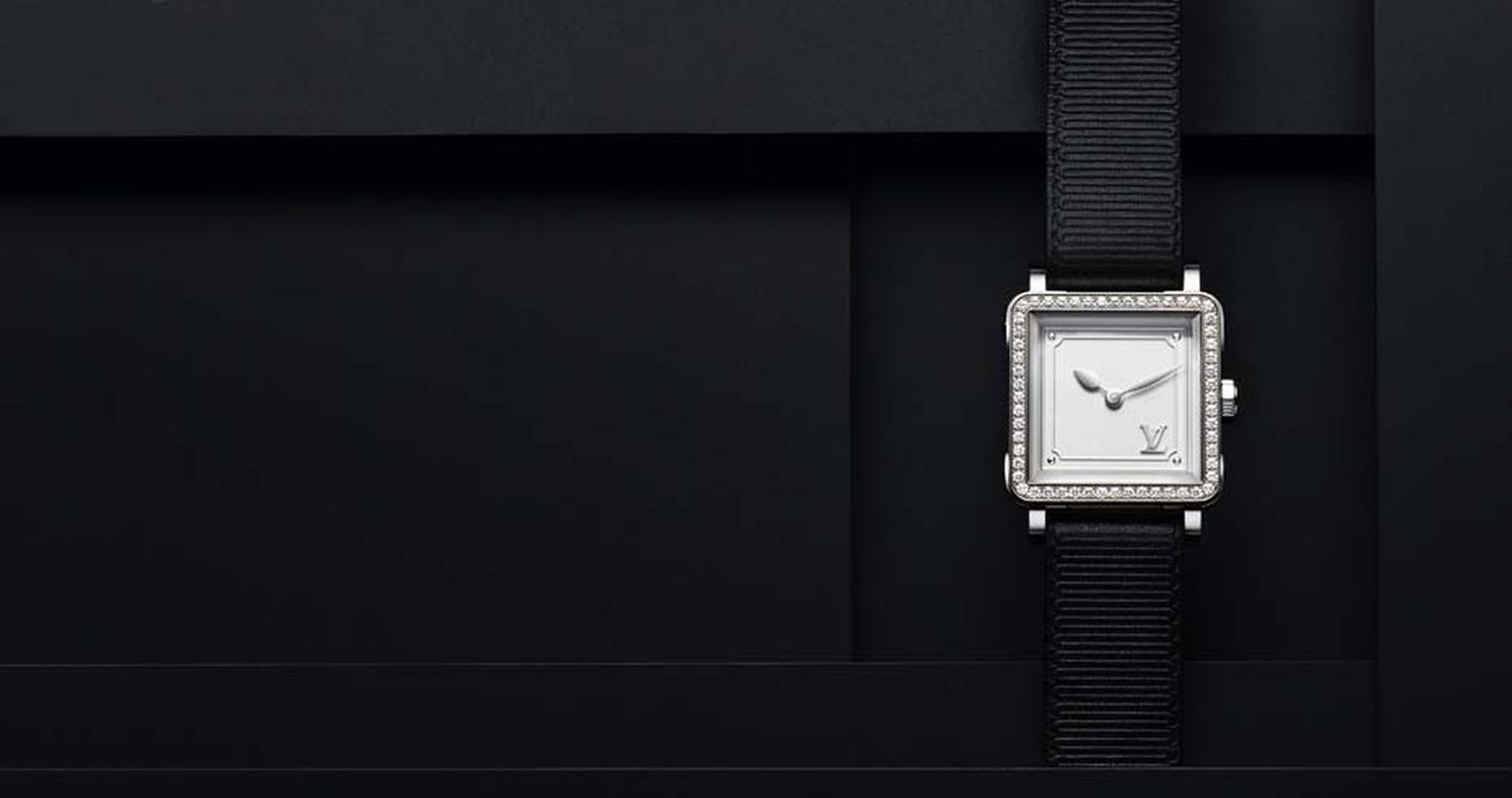 Louis Vuitton Emprise watch in steel, set with 64 diamonds, a silver opalescent dial and a black calfskin strap with gros-grain pattern.