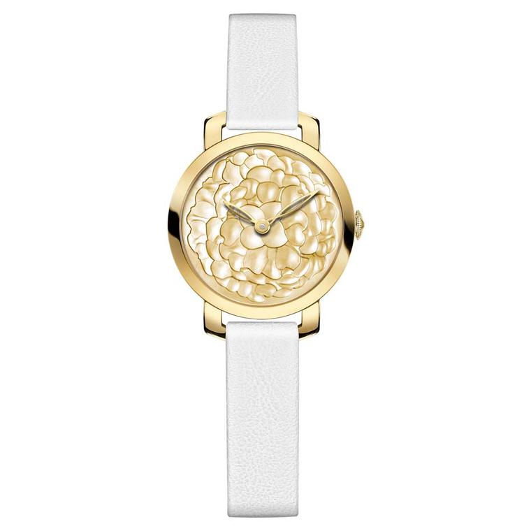 Chaumet Montres Pre´ciuses collection watch in yellow gold featuring a dial with rounded marquetry and polished gold mother of pearl