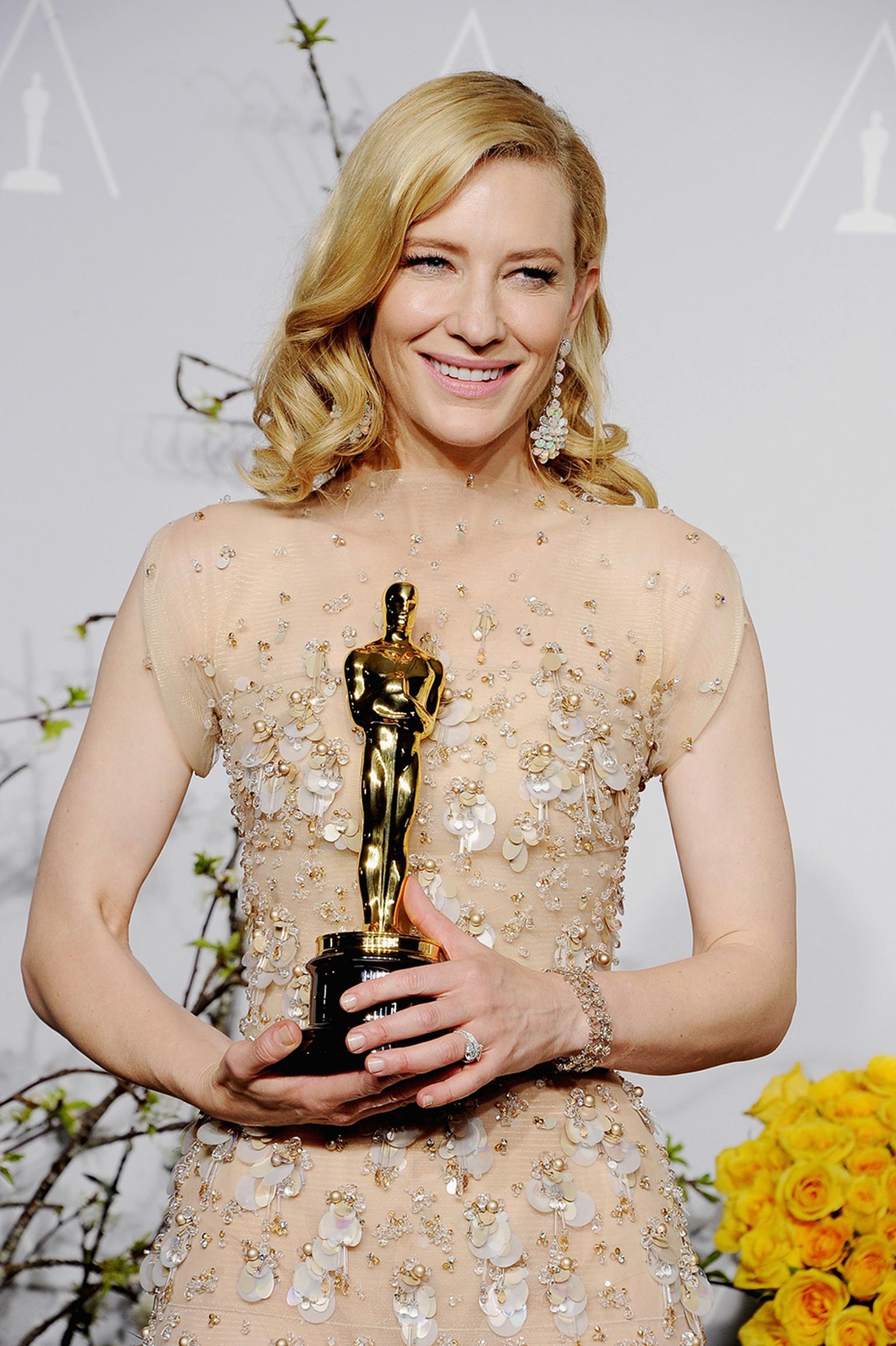 Wearing one-of-a-kind opal earrings from Chopard's 2014 Red Carpet Collection, Cate Blanchett is all smiles after receiving her Academy Award for Best Actress in a Leading Role