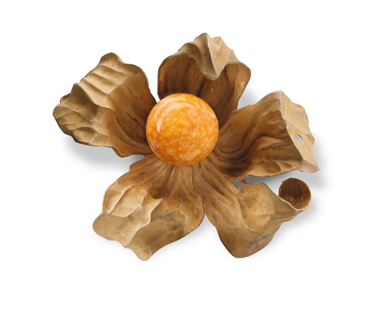 Hemmerle physalis brooch featuring a rare sun-orange melo pearl shining inside a delicate lantern-like case rendered in gold