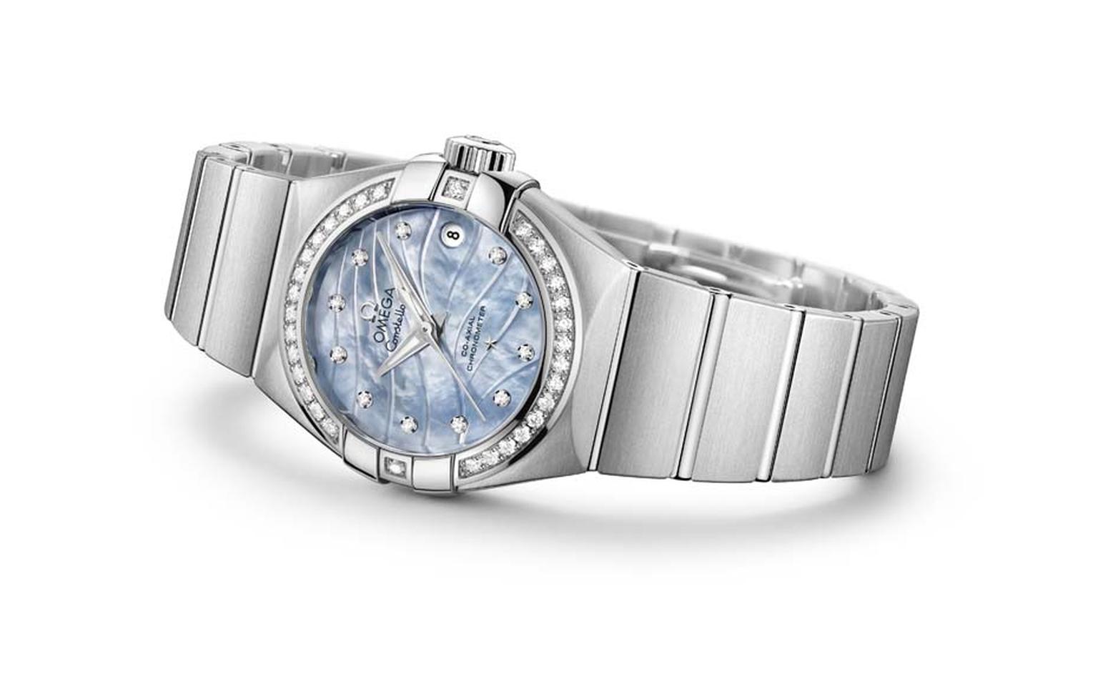 The stainless steel Omega Constellation Pluma features a blue mother-of-pearl engraved dial set with diamonds.