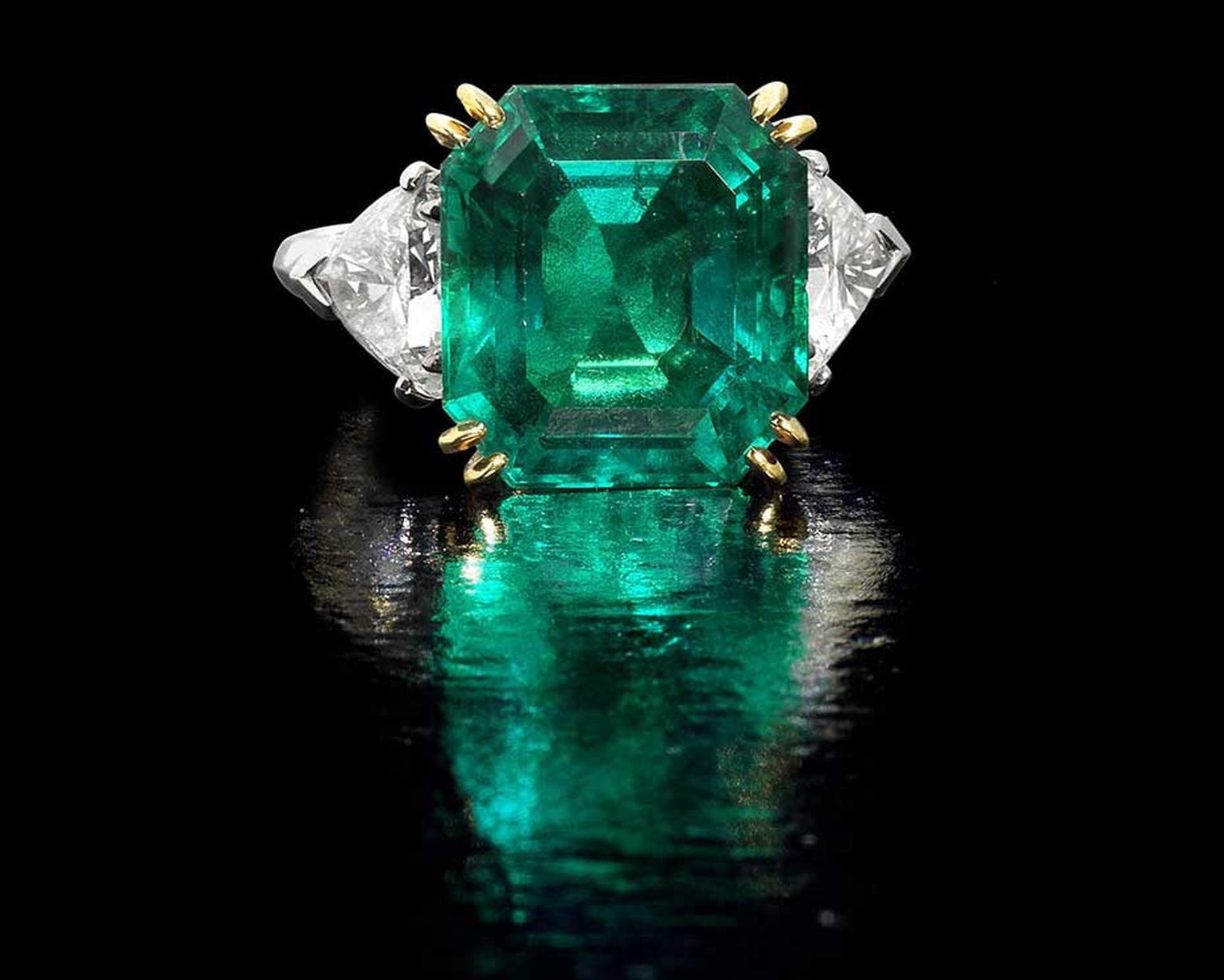 Lot 192, a Colombian emerald and diamond ring. The octagonal step-cut emerald weighs 10.49ct, flanked by triangular-cut diamonds of approximately 2.00ct. Sold for £362,500  (estimate: £150,000-£200,000)