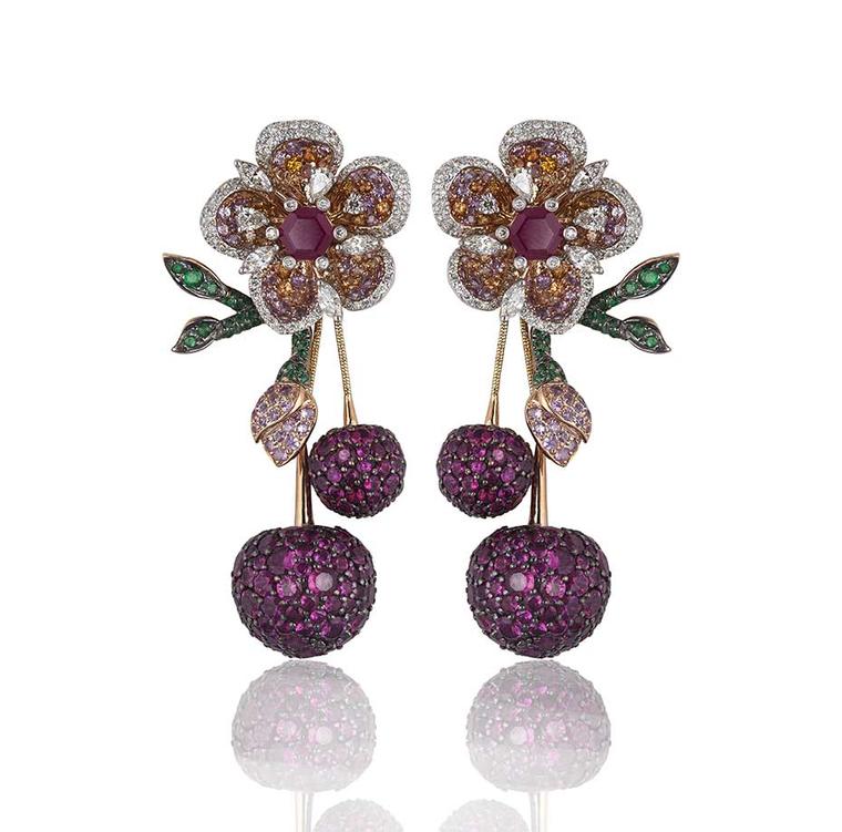 Lot 6, a pair of Gemfields Mozambican ruby, Gemfields Zambian emerald, diamond, pink sapphire and orange sapphire earrings by Mirari, being auctioned as part of a suite (estimate: INR 3,600,000 - 4,350,000; $60,000 - 73,000)