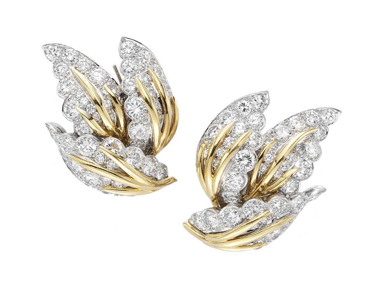 Worn by Dita von Teese to the 2014 Met Ball, the Van Cleef & Arpels Three Leaves Estate earrings featuring diamonds set in platinum, white and yellow gold.
