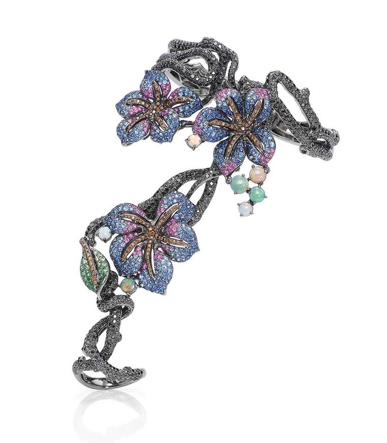 See Wendy Yue's Midnight Flora hand bracelet with black diamonds, opals, tsavorites, blue sapphires and pink sapphires in black gold at the Couture Show Las Vegas