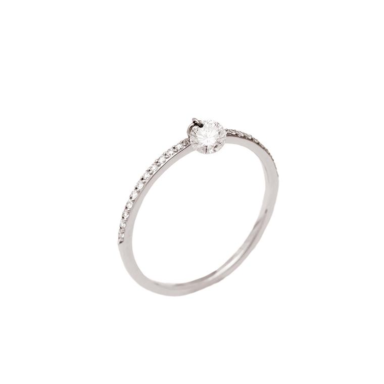 Raphaele Canot Set Free Diamonds collection white gold ring with a pierced diamond suspended from the centre