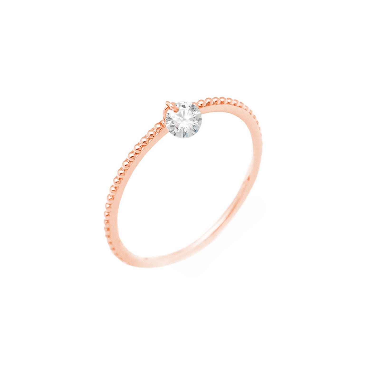 Raphaele Canot Set Free Diamonds collection pink gold ring with a pierced diamond suspended from the centre