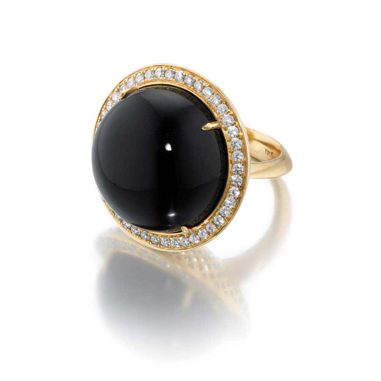 Ray Griffiths yellow gold ring with a central cabochon onyx, surrounded by pavé diamonds