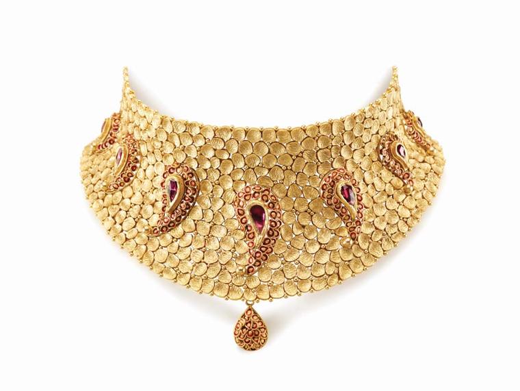 Azva’s beaten gold choker necklace with seven paisley motifs, each studded with rubies and decorated with enamel work.