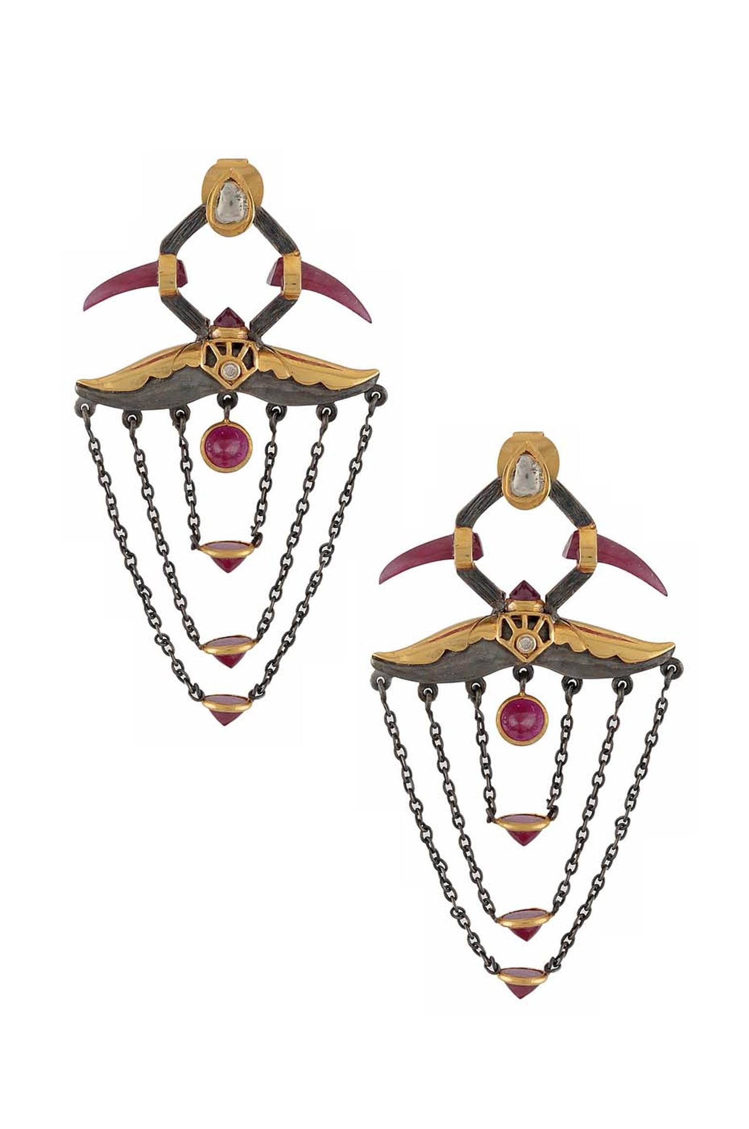 Amrapali Dark Maharaja Blood Horn earrings in silver and gold with rubies and diamonds.