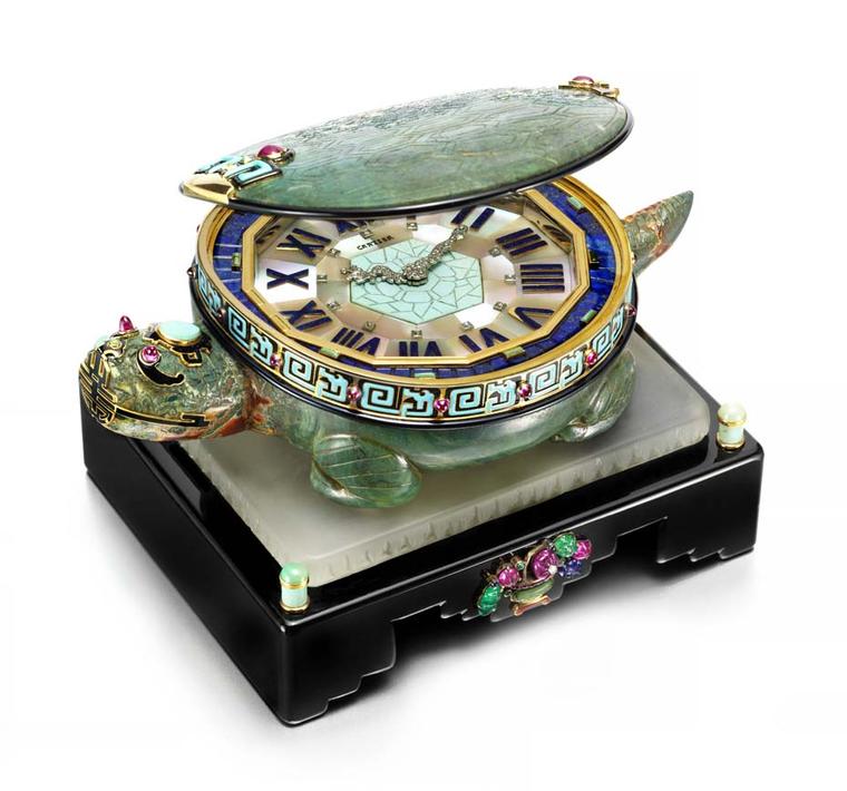 Cartier's 1928 Art Deco Turtle clock, to be exhibited by Siegelson at Masterpiece London, features a clock face edged in gold with diamond-set hands in the form of a dragon, hidden inside a turtle’s shell decorated with black and turquoise enamel and ruby