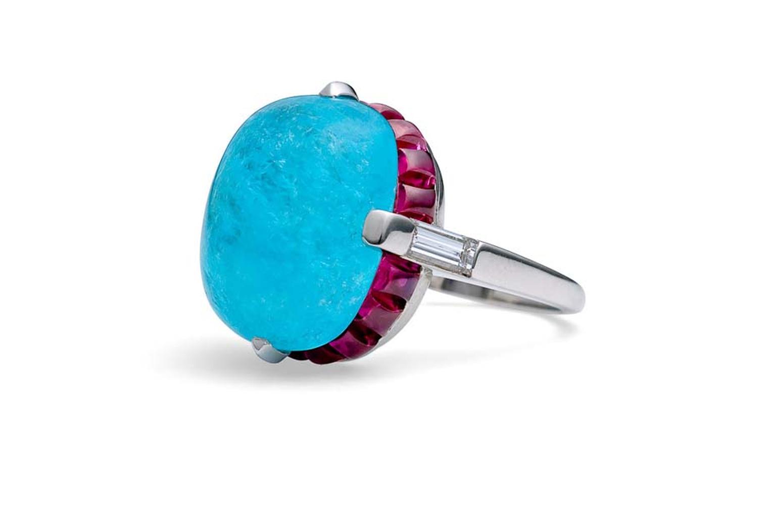 Steven Fox handmade platinum ring with a central 14.04ct Paraiba tourmaline surrounded by natural sugarloaf Burmese rubies and baguette diamonds.