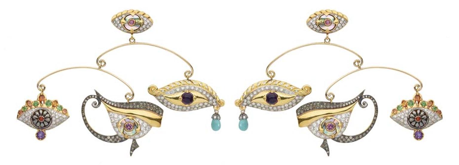 Sylvie Corbelin Fascination collection mobile earrings’ featuring three uniquely shaped gem-encrusted eyes suspended from a central stud, also in the shape of an eye.
