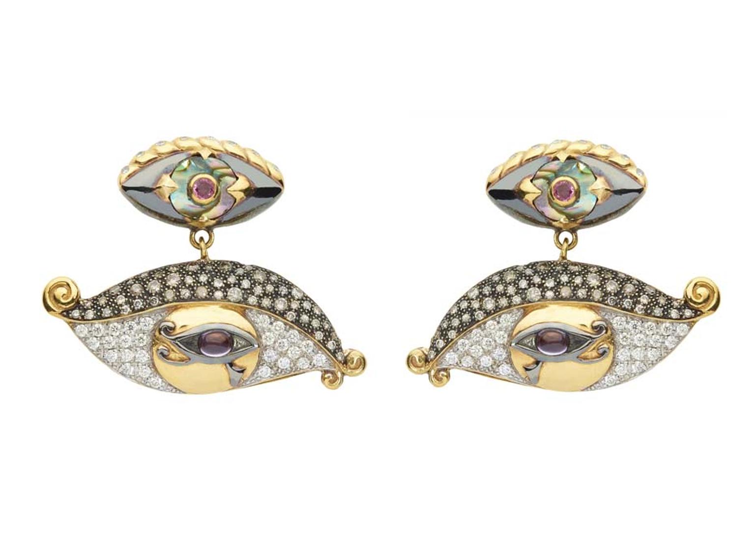 Sylvie Corbelin Fascination collection earrings featuring diamond and gem-encrusted eyes suspended from a central stud, also in the shape of an eye.