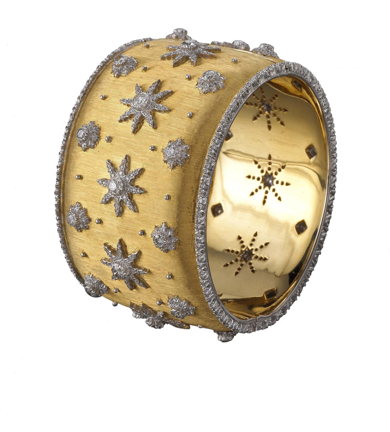 Buccellati cuff bracelet in gold, decorated using the "regato" engraving technique and set with round brilliant diamonds.