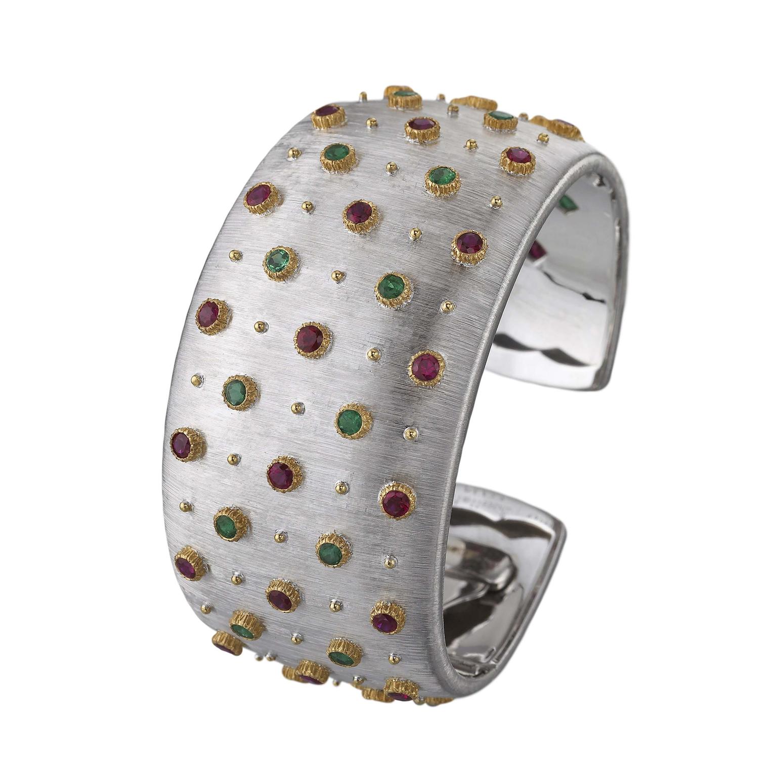 Buccellati cuff bracelet with emeralds, rubies and diamonds, engraved to resemble silk using the "regato" effect.