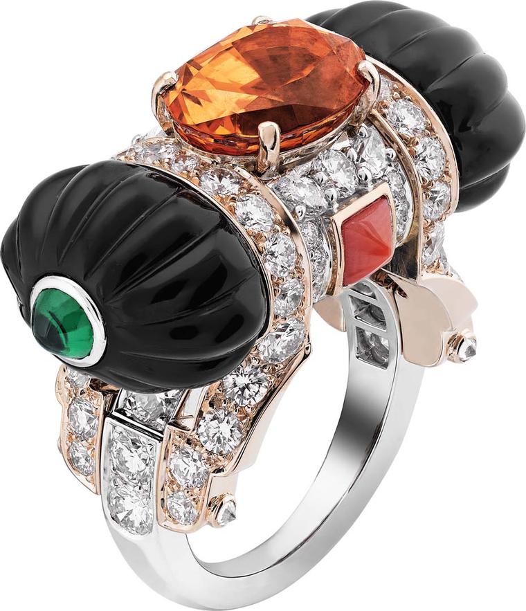 Van Cleef & Arpels Peau d'Ane Happy Marriage collection East Gift ring in white and pink gold with a 5.67ct oval spessartite garnet, round and pear-cut diamonds, onyx, coral and two cabochon emeralds.