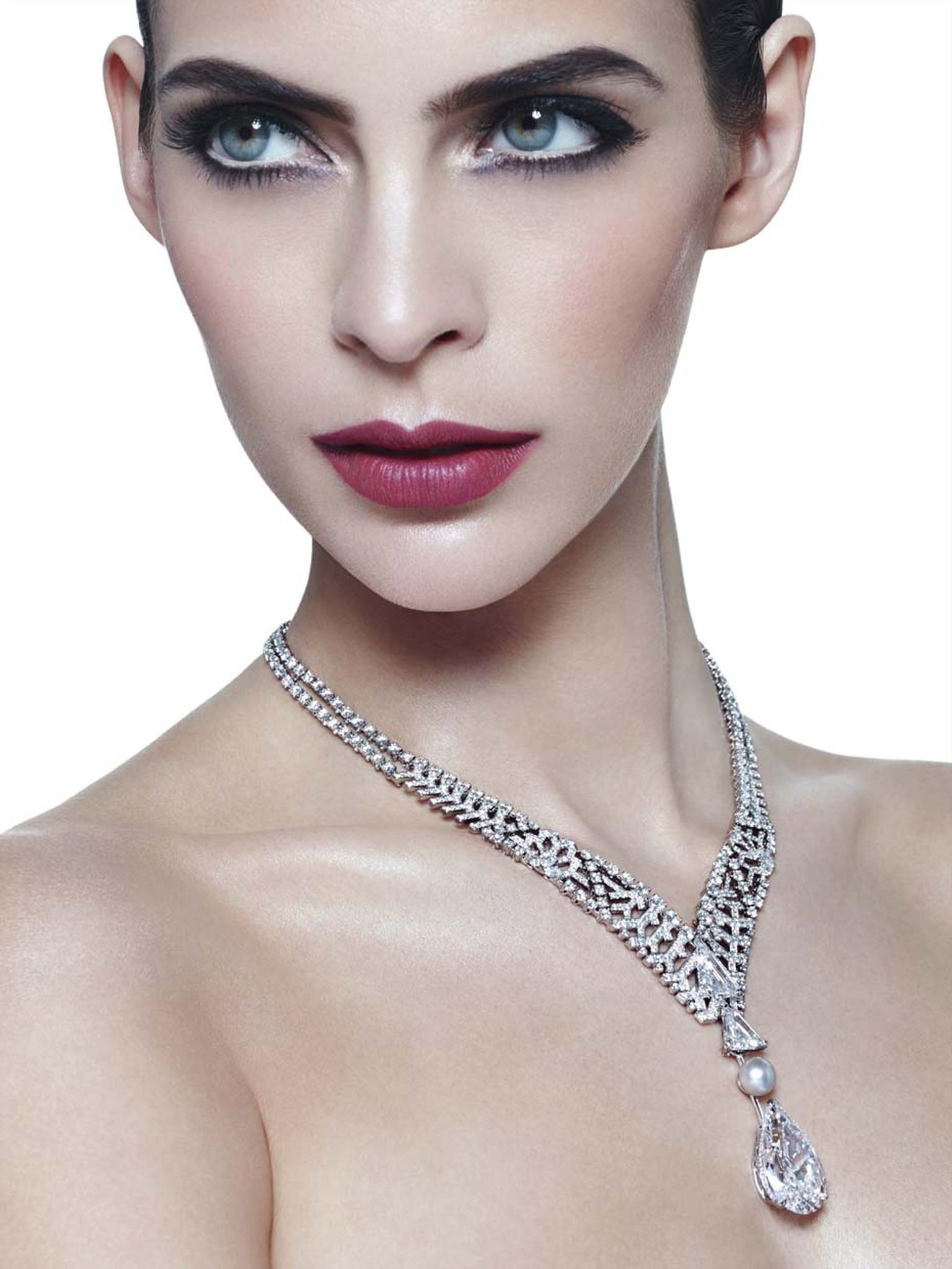 Cartier's Royal collection necklace not only features a flawless diamond but is also adorned with an openwork lattice of diamonds on the necklace which moves down the neck in a V-shape arrangement to converge in a 5.12ct kite-shaped diamond. Beyond the la