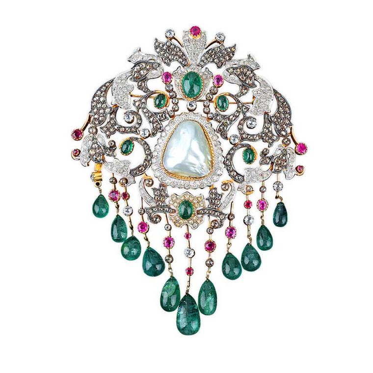Golecha brooch studded with diamonds, rubies, emeralds and a large central pearl.