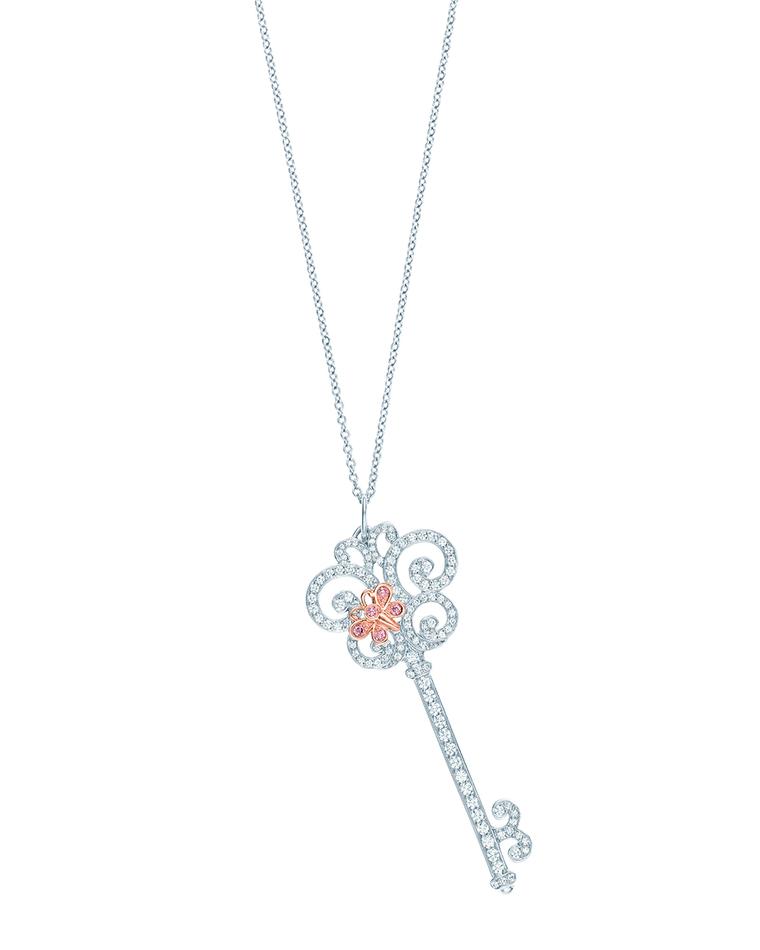 Tiffany Keys Enchant Heart pendant in platinum featuring a pink diamond butterfly set in rose gold perched upon a white diamond key.