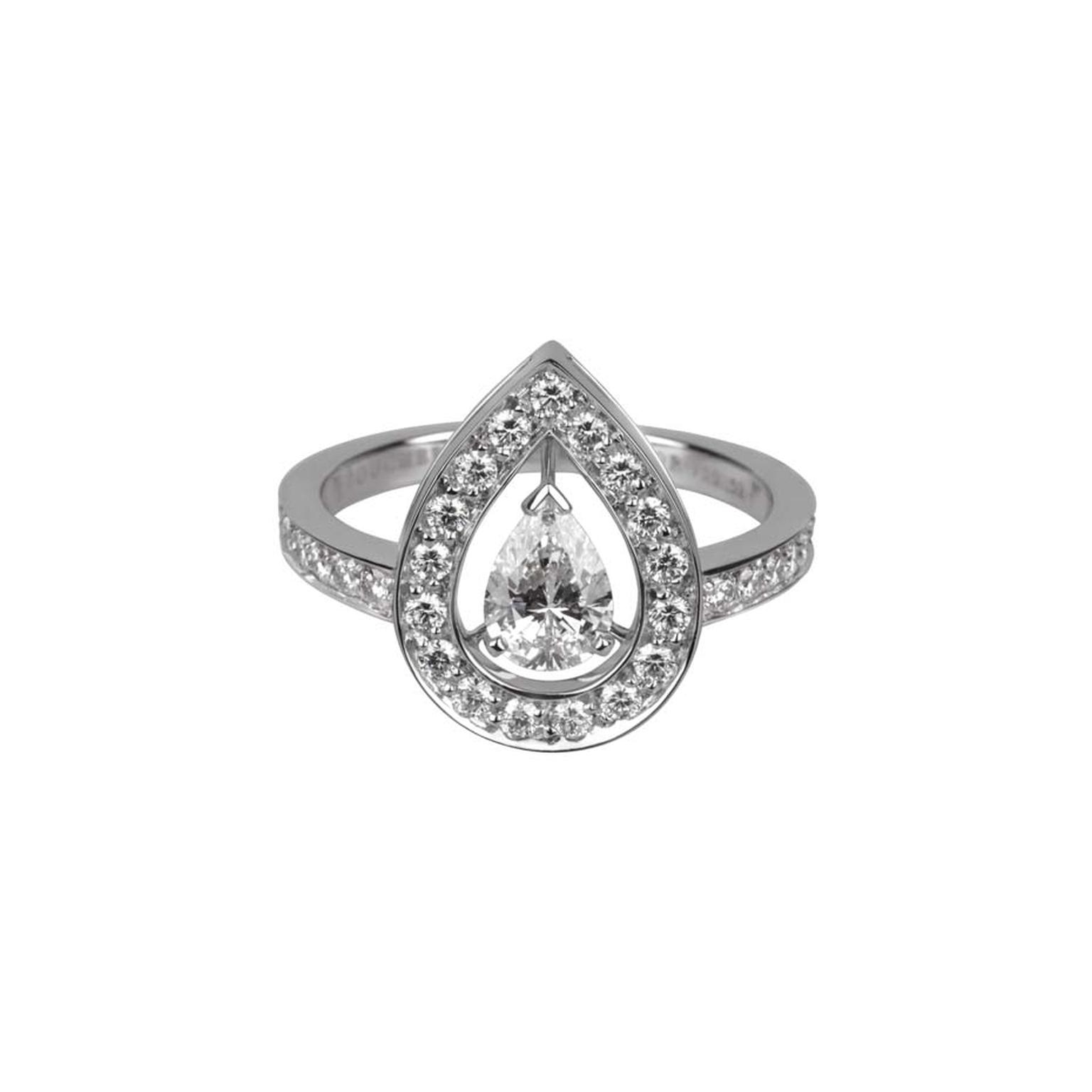 Boucheron Ava white gold engagement ring features a central pear-cut diamond that appears to float in mid-air amidst thirty-five round diamonds.