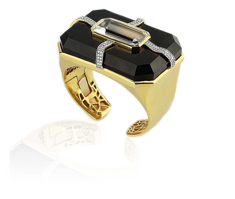 Kara Ross' Cava cuff features rock crystal inset black onyx, held in place by four ribbons of sparkling diamonds.