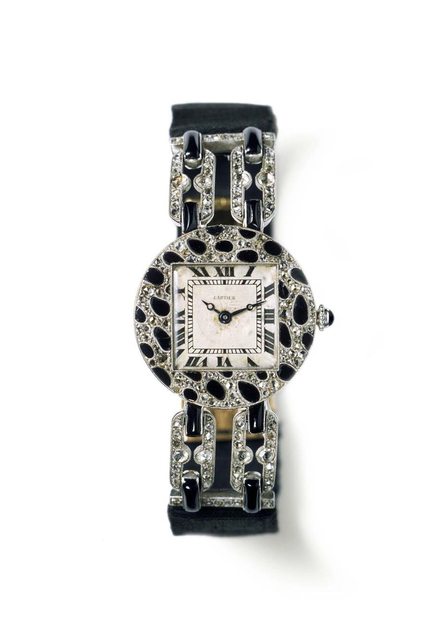Cartier's 1914 wristwatch with a motif of panther spots, featuring a round case in polished platinum, pavéd with rose-cut diamonds and onyx.