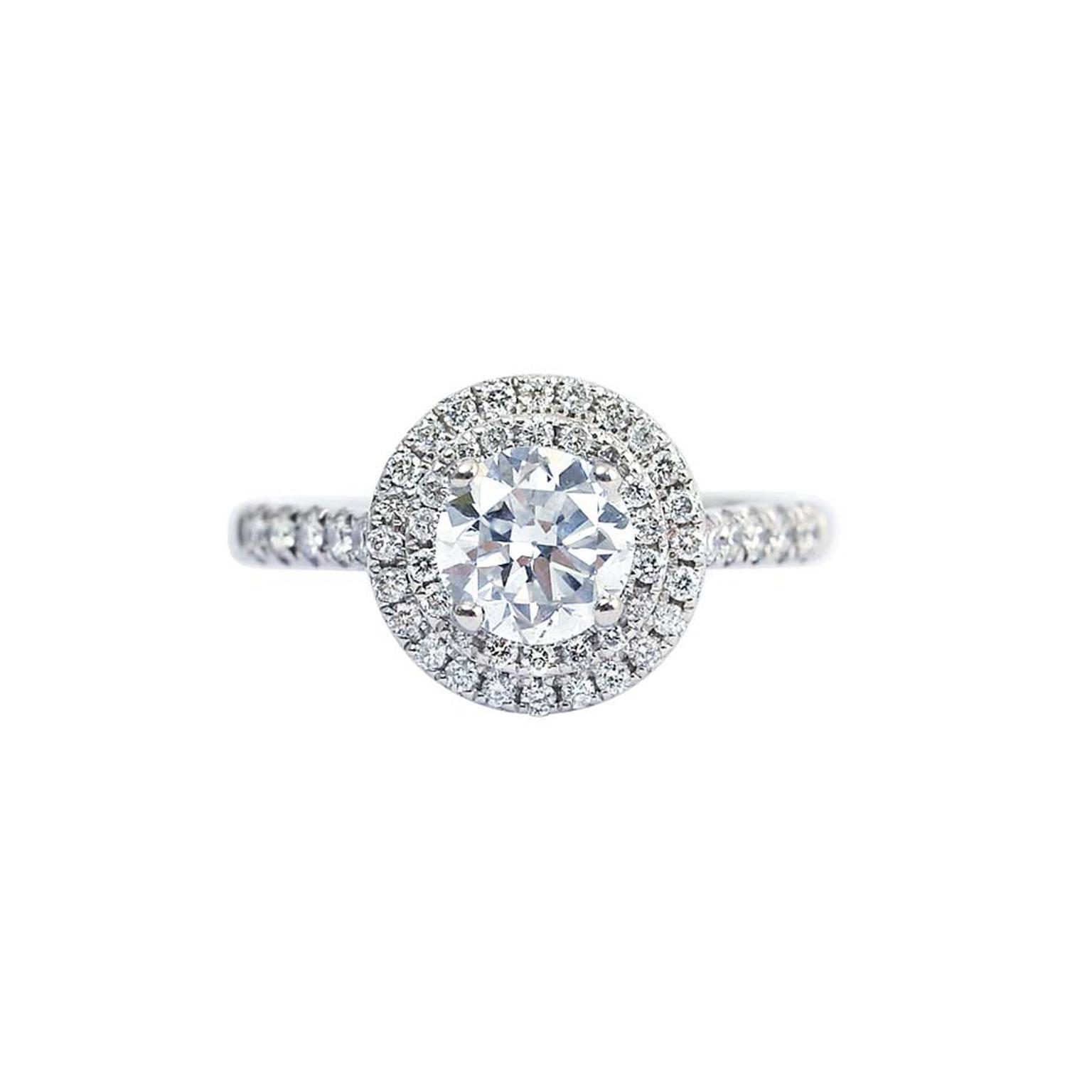 Gee Woods' finished diamond engagement ring featuring a brilliant-cut diamond surrounded by a melée of diamonds.
