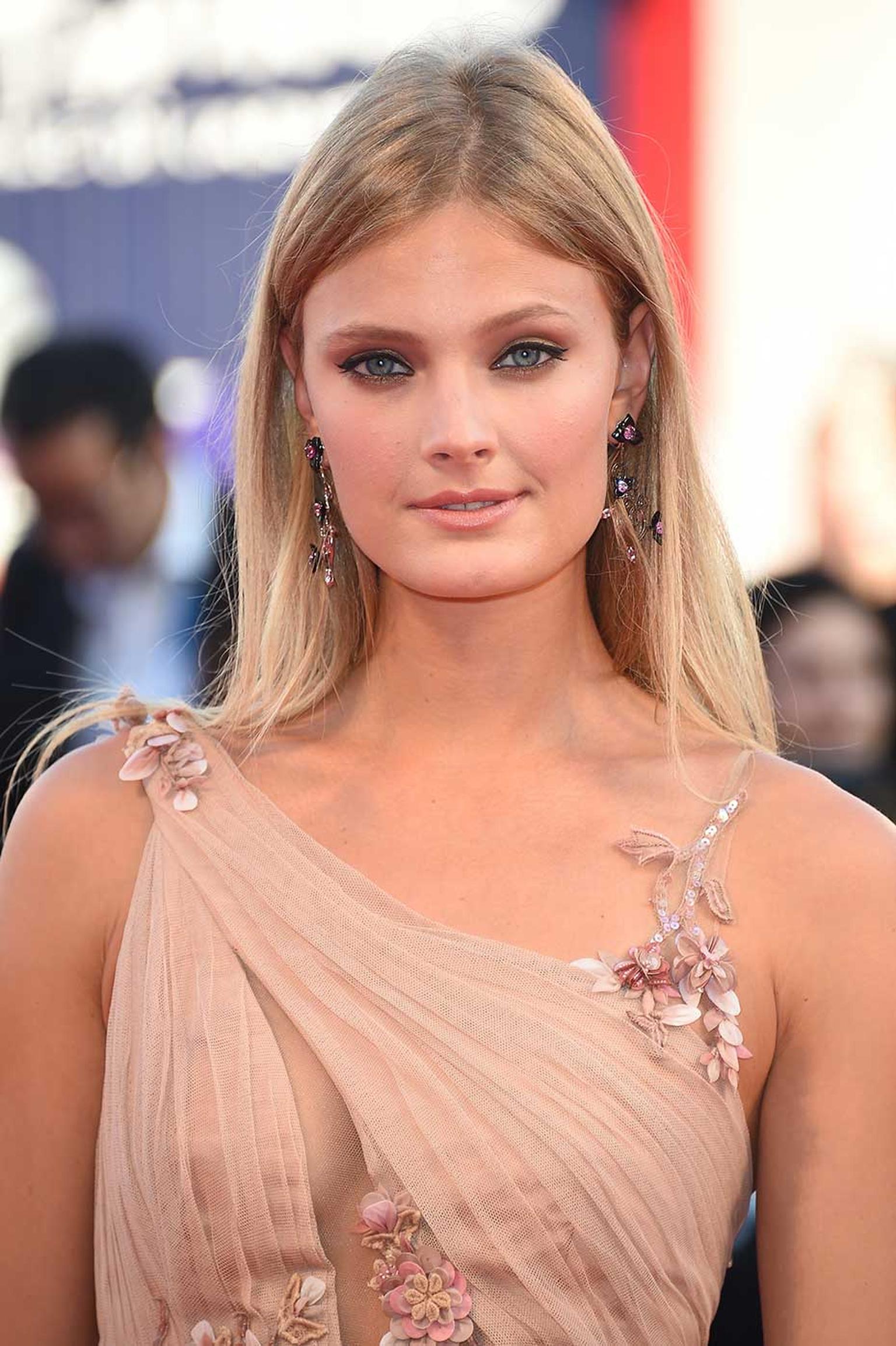 French model Constance Jablonski walked the red carpet at the Venice Film Festival 2014 in floral Chopard earrings set with onyx, heart-shaped pink sapphires, marquise-cut spinels and black brilliant-cut diamonds.