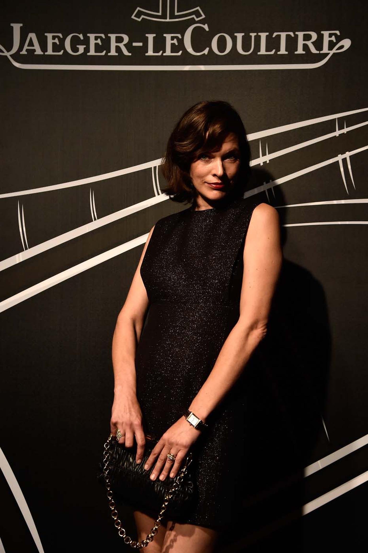 Milla Jovovich strikes a pose wearing a Jaeger-LeCoultre watch during the 2014 Venice Film Festival's Gala Dinner.
